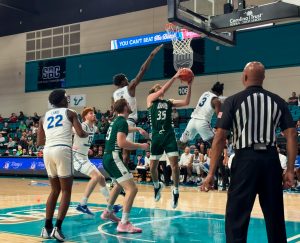 Vic Searls (#35) fighting for a contested layup through MTSU defenders.