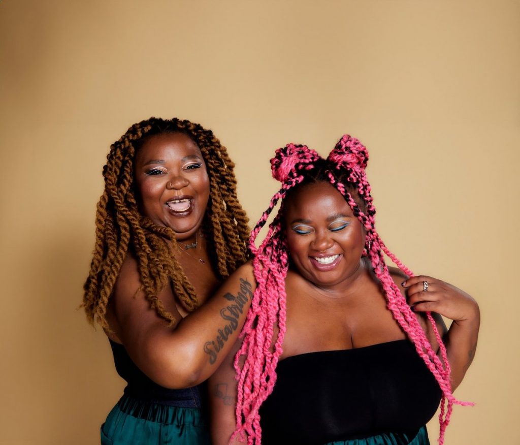 A press photo of musical duo SistaStrings: Chauntee Ross and Monique Ross. 