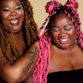 A press photo of musical duo SistaStrings: Chauntee Ross and Monique Ross.