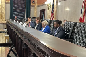 The Ohio Ballot Board sits at a long desk.