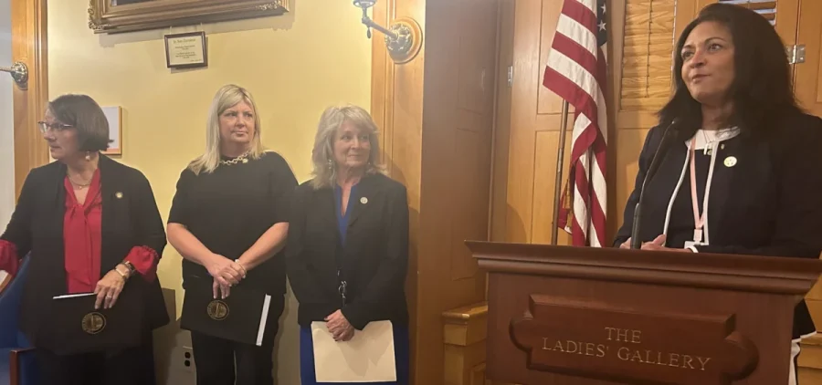 A group of four women who support a concurrent resolution to bring awareness of perinatal mental health.