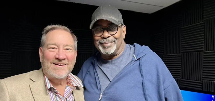 Scott Shawver and Ray Macklin pose for a portrait in the radio booth