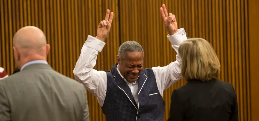 Evin King celebrates being freed from prison in a courtroom.