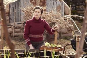 Shown: Helen Herriot (Rachel Shenton) kneeling in garden looking contemplative into the distance