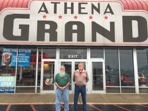 Athena Grand co-owners Rick Frame and Mike Little stand outside the theater in Athens.