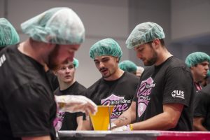 Ohio Football players packing meals at the Cure Bowl charity event on Dec. 19, 2024.