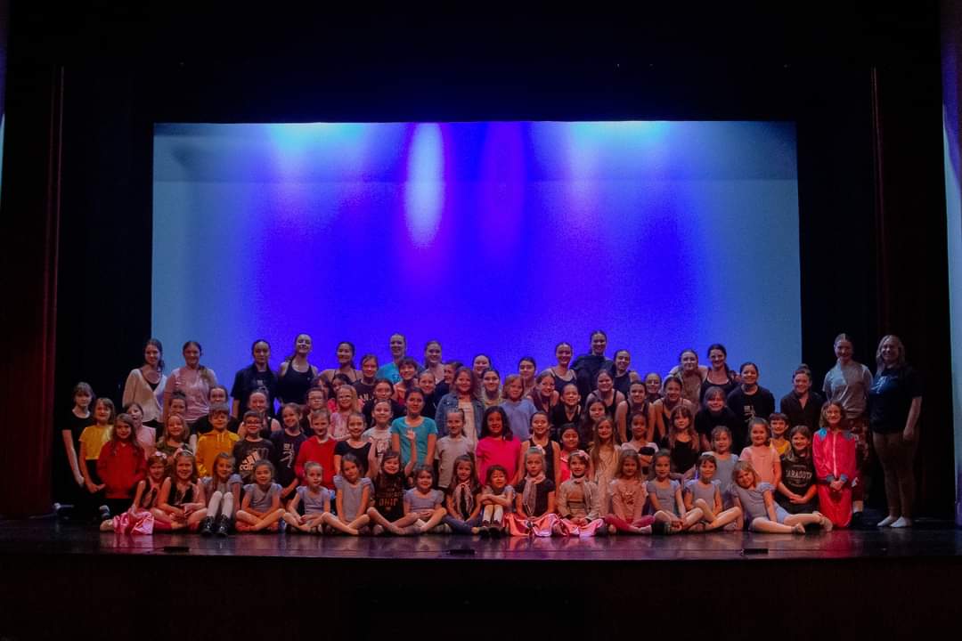 An image of people in a dark theater.