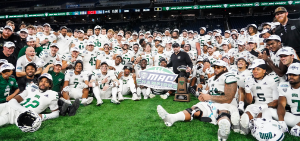 Ohio poses for a picture at Ford Field after winning the 2024 MAC Championship.