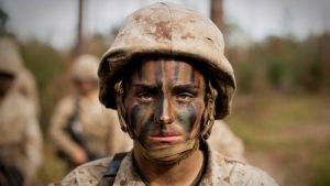 Maria Daume, born in a prison in Russia became one of the first female Marines with infantry contracts. (Parris Island, SC) Show here in brown camo uniform with camo face paint.