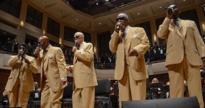 A Symphony Celebration: The Blind Boys of Alabama with Dr. Henry Panion, III- group of five singing onstage