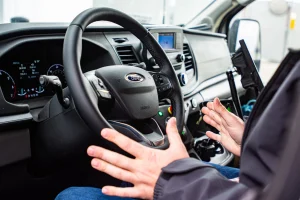 A pair of hands off of a steering wheel