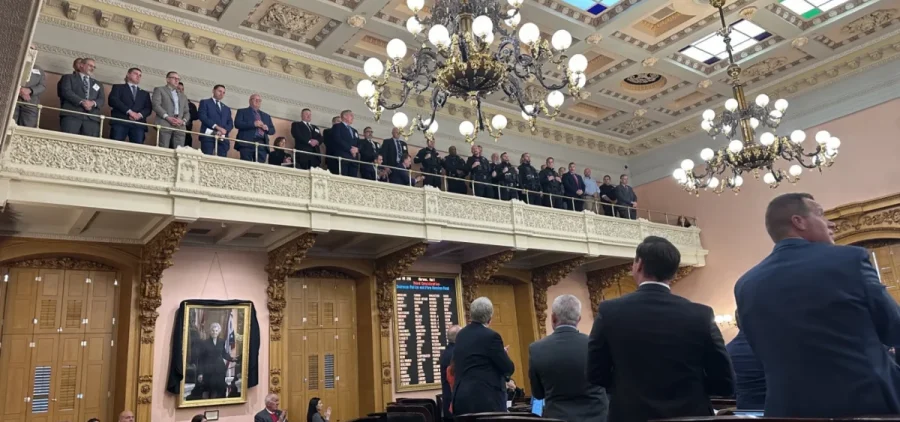 Police officers from around Ohio receive a standing ovation from the House