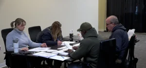 Workers at the Franklin County Board of Elections audit results in December 2024.