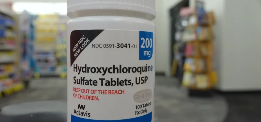 Container of Hydroxychloroquine Sulfate tablets in a drugstore.