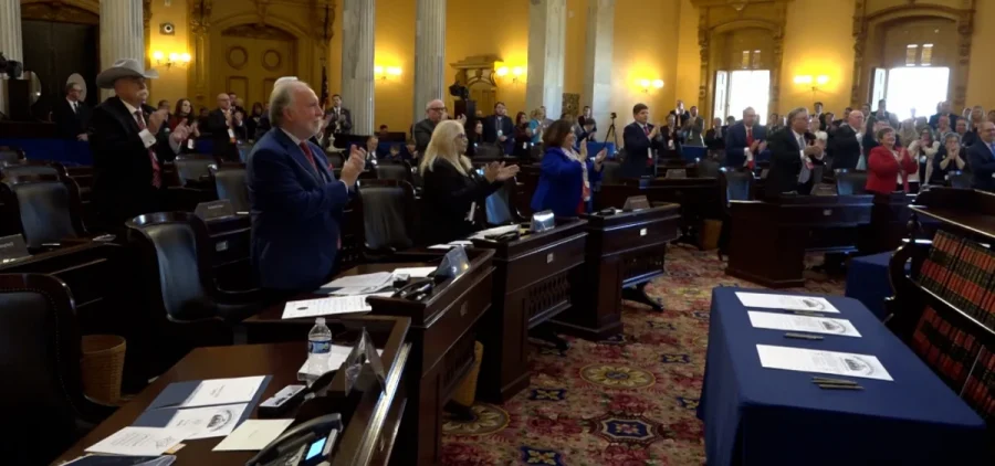 Members of the Ohio Electoral College applaud as all 17 votes are given to Donald Trump and JD Vance.