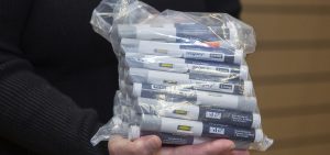 Patient Lory Osborn holds a bag of Wegovy pens used in her treatment at the Medical Weight Management office at West Virginia University in Morgantown, W.Va.