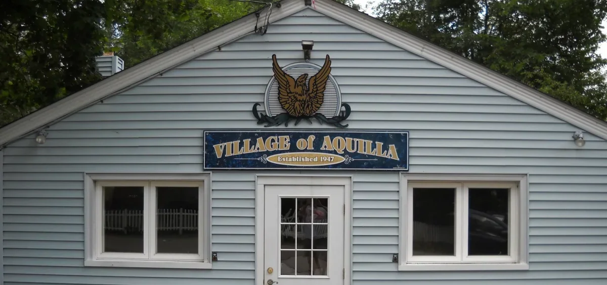 The northeast Ohio village of Aquilla meeting place with the village logo on the front