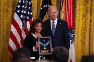 Victoria Secrest receives her father's Medal of Honor from President Biden