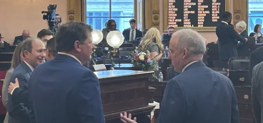 Former Speaker Jason Stephens (R-Kitts Hill) and newly elected Speaker Matt Huffman (R-Lima) talk to one another before the 136th Ohio General Assembly Swearing-in ceremony.