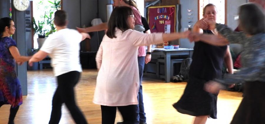 An image of people in a Scottish dance class.