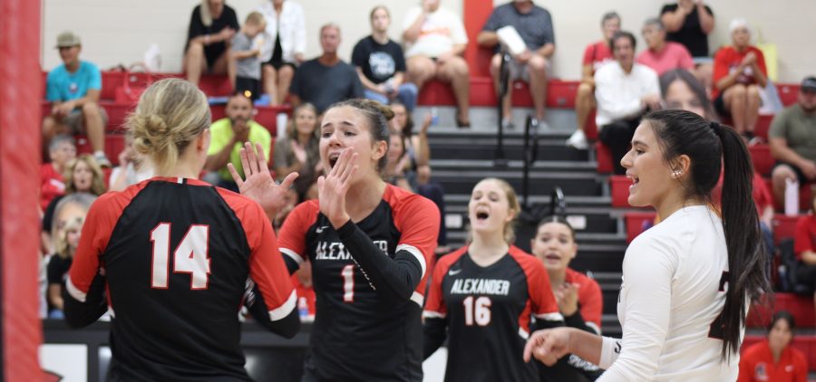 Spartan Meena Juedes celebrates a kill with her teammates