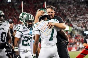 Ohio Football head coach Brian Smith hugging Chase Hendricks after his 67-yard touchdown pass.