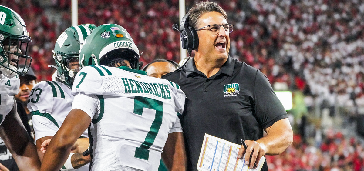Ohio head coach Brian Smith celebrating with Chase Hendricks after his TD vs Ohio State.