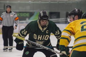 Ohio Hockey captain Jack Glen lining up for a faceoff in the offensive zone.