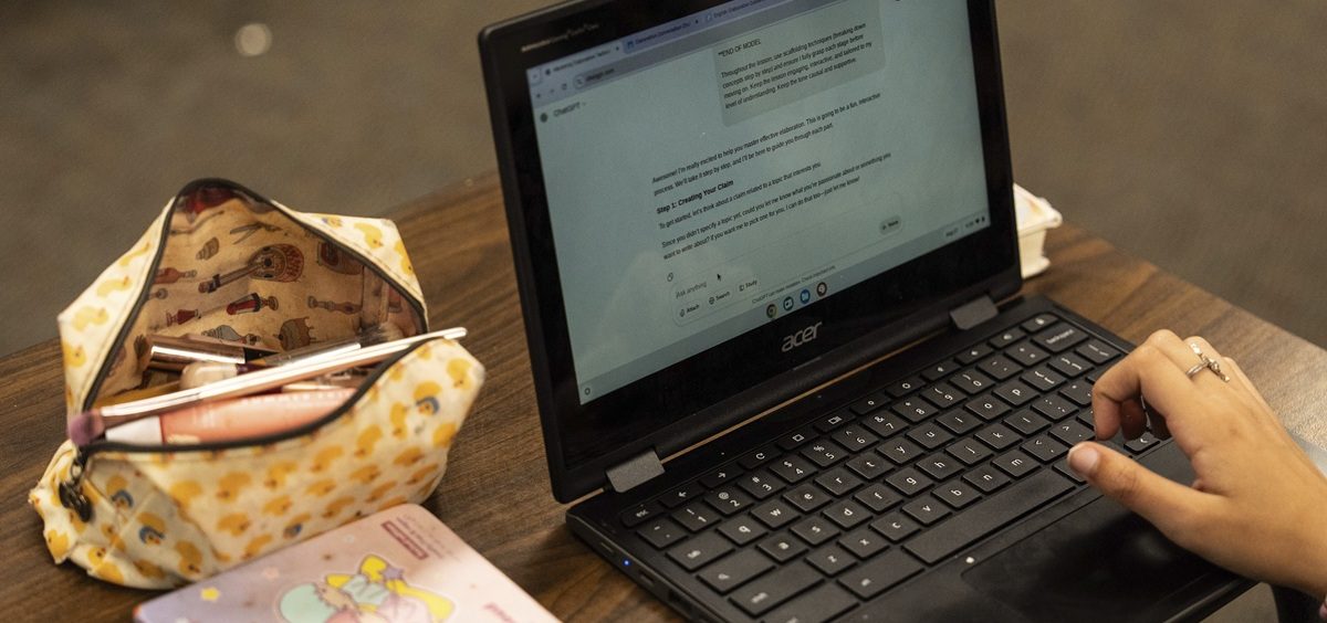A student types a prompt into ChatGPT on a Chromebook