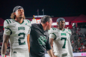 DJ Walker (left), John Hauser (middle) and Chase Hendricks (right) walking off the field after falling to Rutgers.