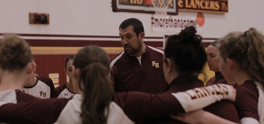 The Lancers huddle up during a timeout