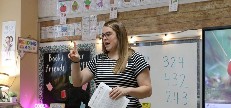 SNAP-Ed Program Assistant Sarah Layton teaches a nutrition less to a classes of elementary school students.