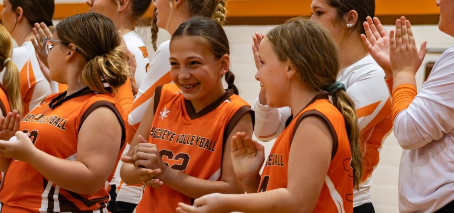 Buckeye players await first serve joined by the youth volleyball program