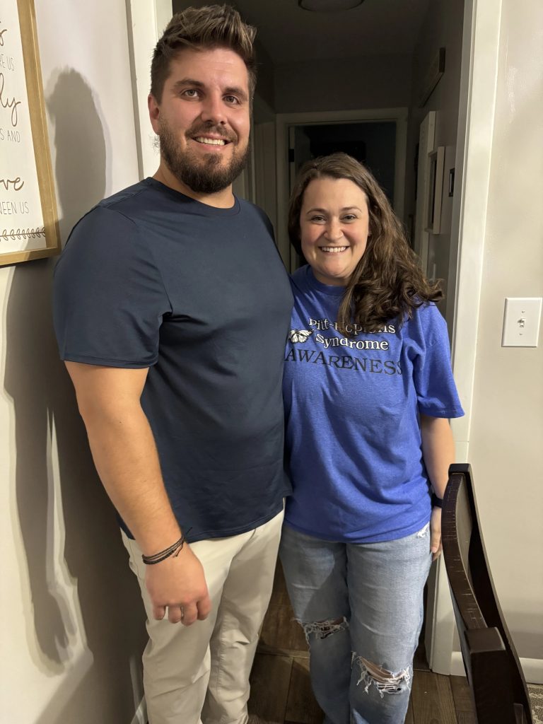 Michael and Brooke Magyar pose for a picture in their home
