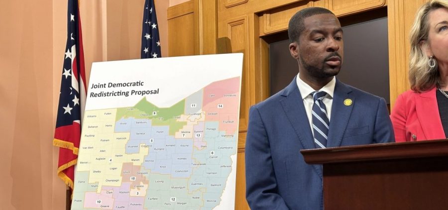 Ohio Democrats introduce a voting map proposal standing on a easel.