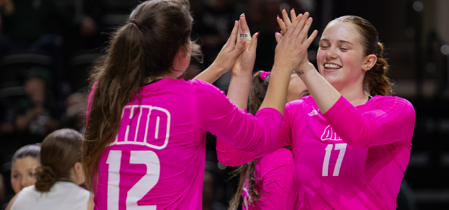 Kendall White (12) and Bailey Blair (17) celebrating after an Ohio point in their match vs EMU.