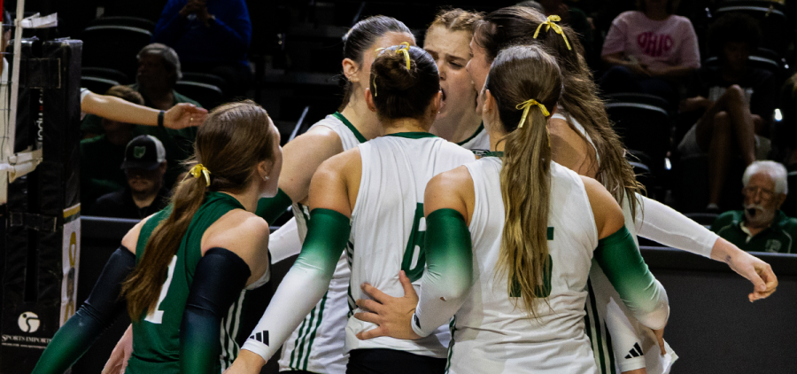 The Ohio Volleyball team huddling after a point in their match against Buffalo.