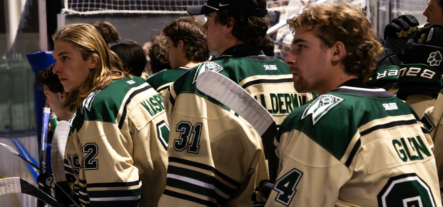 Ohio Hockey players on the bench looking onto the ice pregame against Illinois State.