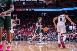 Ohio Men's Basketball guard Jackson Paveletzke dribbling against Louisville.
