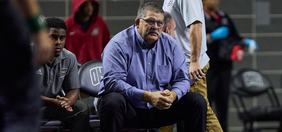 Ohio Wrestling head coach Joel Greenlee sitting on the bench during the Ohio Showcase.