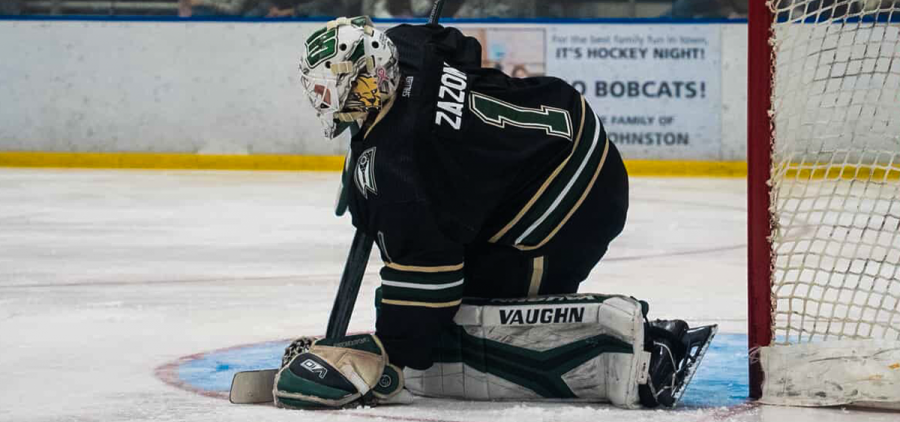 Ohio goalie Matt Zazon covering the puck against Kent State.