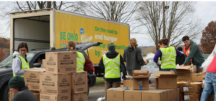 Volunteers with the Southeast Ohio Foodbank work to distribute food.