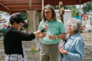Howe and Nelson prepare Sequoyah descendant Winnie Guess Perdue for a shot in the Morelos cemetery.