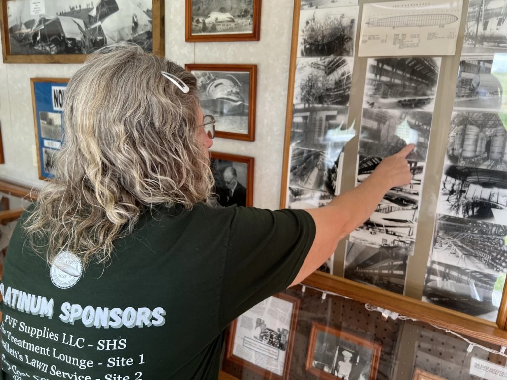 Theresa Rayner points out parts of the USS Shenandoah at her mobile museum, parked in Ava, Ohio.