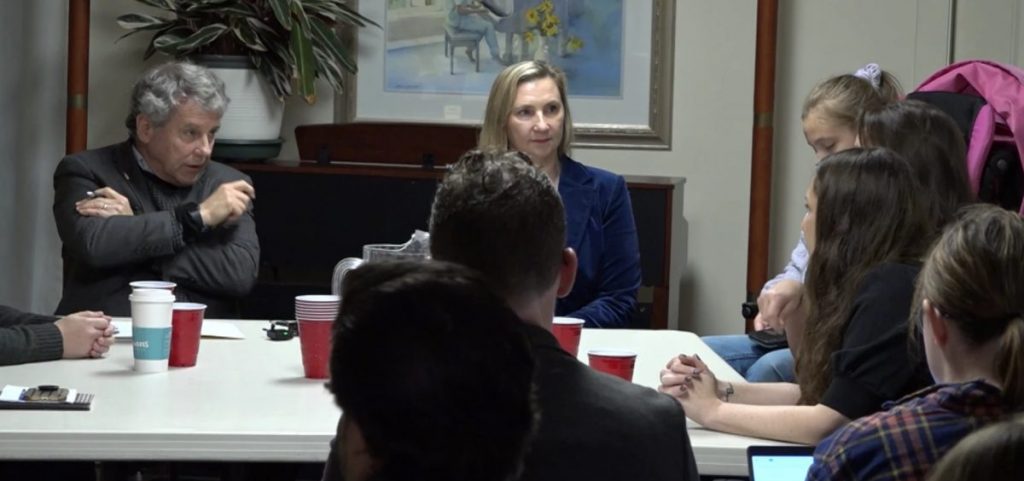 Former US Senator Sherrod Brown speaks to parents of Medicaid recipients at a roundtable.