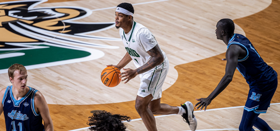 Ohio Men's Basketball forward Javan Simmons handling the ball against Maine.