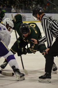 Ohio Hockey forward Luc Reeve taking a face-off against Niagara.