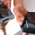 Young persons use their phones to view social media