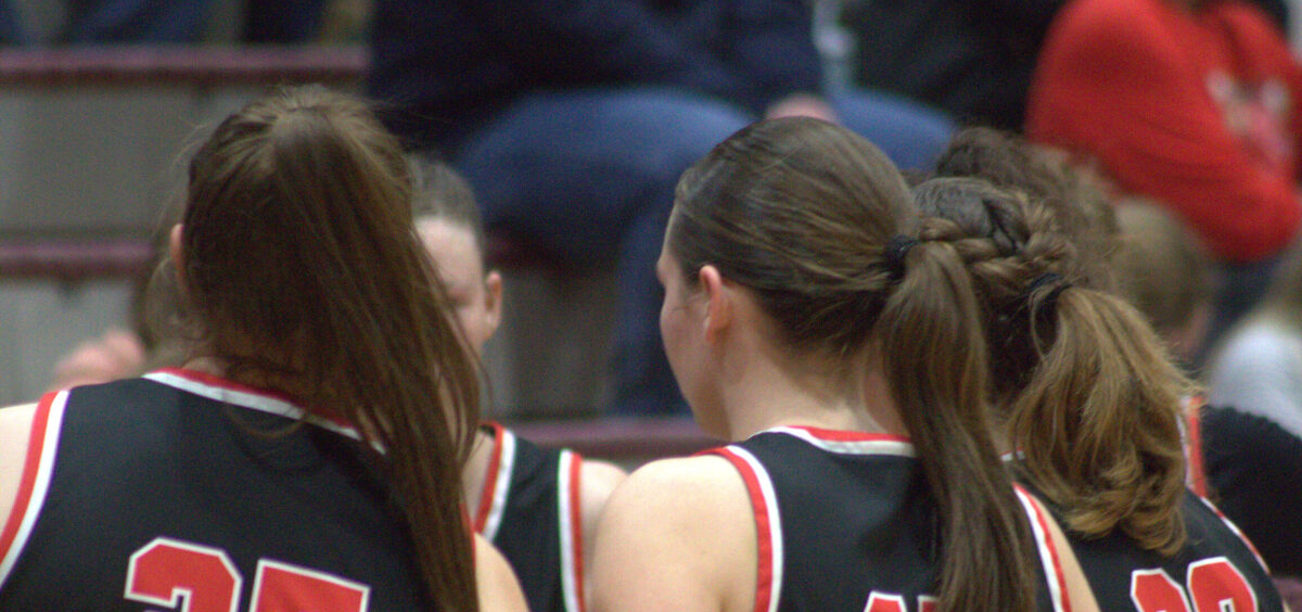 Alexander team huddles up during a timeout near the end of the game.