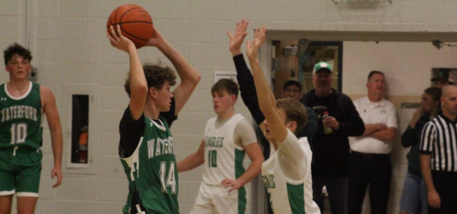Reese Lang looking to pass as he is being defended.